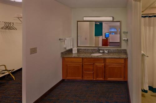 a bathroom with a sink and a mirror at Residence Inn by Marriott Hartford Downtown in Hartford