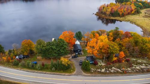 an aerial view of a house on an island next to a road at Muskoka Escape in Port Carling