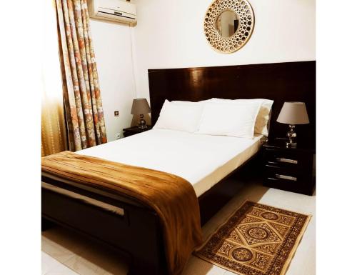 Ein Bett oder Betten in einem Zimmer der Unterkunft Villa Lorangeraie, Wilaya de Tlemcen