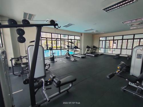 a gym with rows of treadmills and machines at Da Best Guesthouse One Maxim Sentul Nice Cozy Condo 3 Rooms Aircond in Sentul KL in Kuala Lumpur