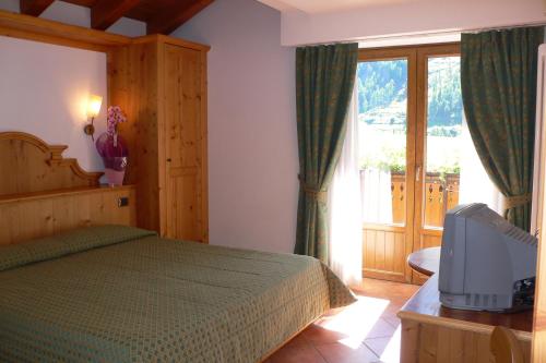 Postel nebo postele na pokoji v ubytování Albergo du Soleil
