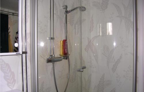 a shower in a bathroom with a shower at Amazing Home In Ryssby With 1 Bedrooms, Sauna And Wifi in Hörda