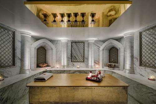 a large room with a table and a ceiling at Radisson Blu Hotel & Suites GRT Chennai in Chennai