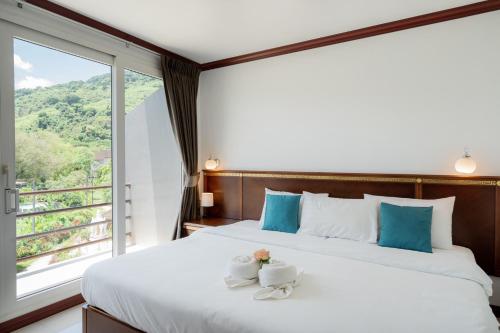 Postel nebo postele na pokoji v ubytování Hotel De Karon