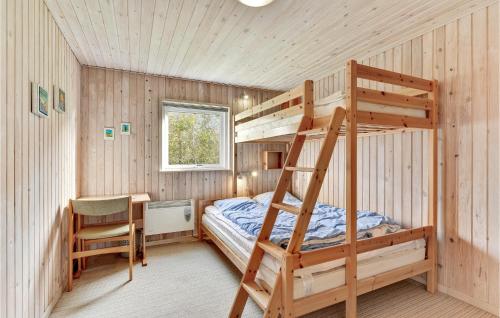 a bedroom with a bunk bed and a desk and a ladder at Awesome Home In Vinderup With 4 Bedrooms And Wifi in Vinderup