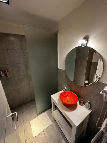 a bathroom with a sink and a mirror at Belle Vie Suites in La Rioja