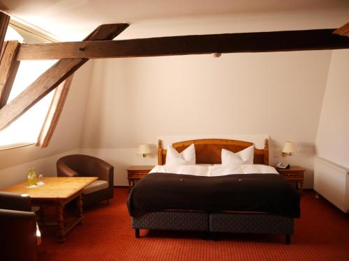 Krevet ili kreveti u jedinici u okviru objekta Garni-Hotel zum alten Ratskeller