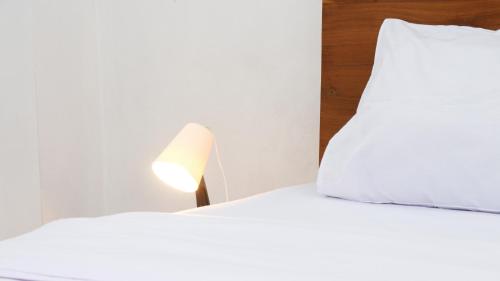 Ένα ή περισσότερα κρεβάτια σε δωμάτιο στο Donna's Hus
