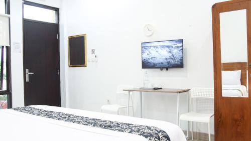 Ένα ή περισσότερα κρεβάτια σε δωμάτιο στο Donna's Hus