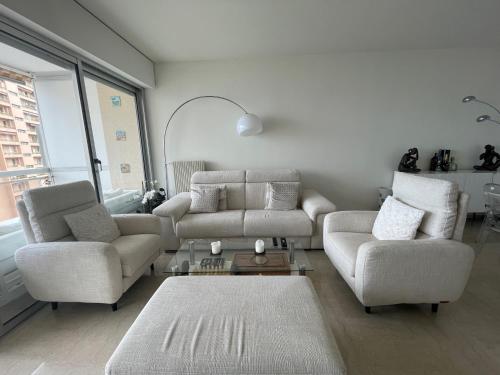 a living room with a couch and two chairs at F1 Exclusive 100-sqm Monaco Apartment with Private Parking in Monte Carlo