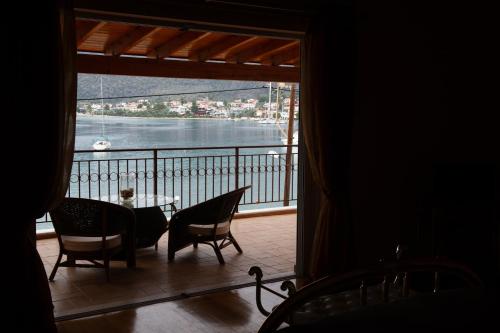 a view of a balcony with a table and chairs at Villa Pasithea in Korfos