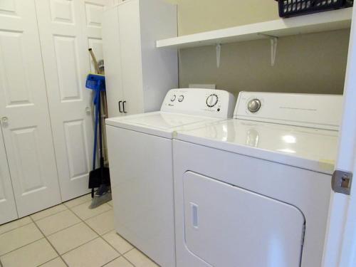 a white washer and dryer in a kitchen at Paradise Canyon Golf Resort, Signature Luxury Villa 380 in Lethbridge