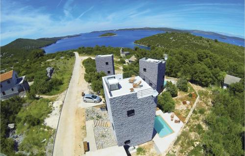 an aerial view of a building with a lake in the background at Amazing Home In Dragove in Dragove