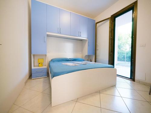 Un pat sau paturi într-o cameră la Pomposa Residence