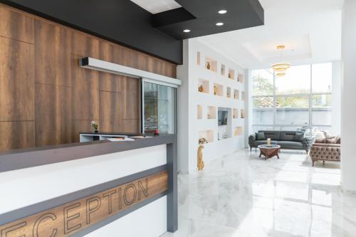 a lobby with a reception counter in a building at The Hera Maltepe Otel & Spa in Istanbul