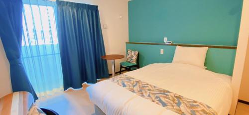 Cama o camas de una habitación en KOHALA　HOTEL
