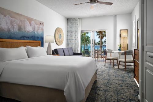 a bedroom with a large bed and a living room at Marriott's Ocean Pointe in Palm Beach Shores