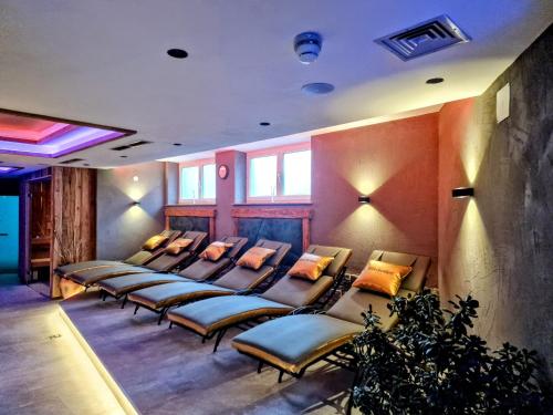 a row of chairs in a waiting room at Hotel Grieserhof in Lermoos