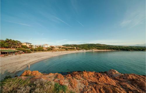 a view of a beach with people on the shore at Bilo Sup in Isola Rossa