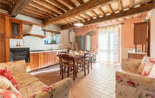 a kitchen and dining room with a table and chairs at La Casa Di Valcerosa in Apecchio