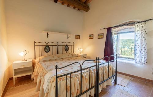 a bedroom with a bed and a large window at La Casa Di Valcerosa in Apecchio