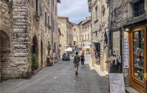 a man walking down a street in an alley at La Casa Di Valcerosa in Apecchio