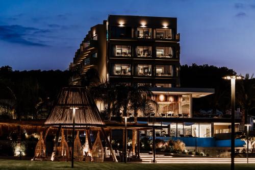 a building at night with a hotel at Cavo Zoe Seaside Hotel in Protaras