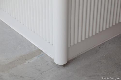 a white radiator on the side of a wall at KIRO Hiroshima by THE SHARE HOTELS in Hiroshima