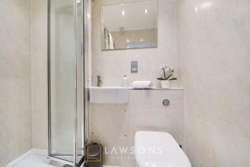 a bathroom with a shower and a toilet and a sink at Stylish Living by Lawsons - 3 Ensuites and Parking for 2 Cars in Windsor