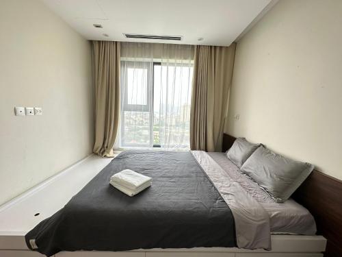 Ένα ή περισσότερα κρεβάτια σε δωμάτιο στο Imperia Garden 143 Nguyễn Tuân Thanh Xuân