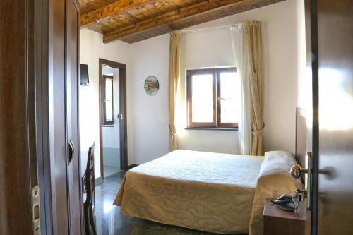 A bed or beds in a room at Agriturismo San Martino