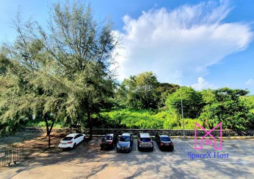 a group of cars parked in a parking lot at Gold Coast Morib Resort in Banting