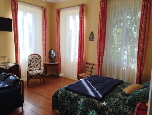 Postel nebo postele na pokoji v ubytování Gîte ou chambres d'hôtes La Burthe