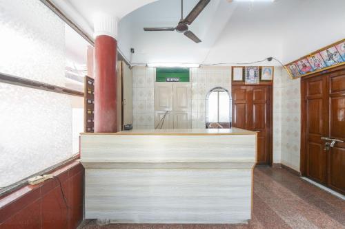 a kitchen with a counter top in a room at SPOT ON Harini Lodge in Chennai