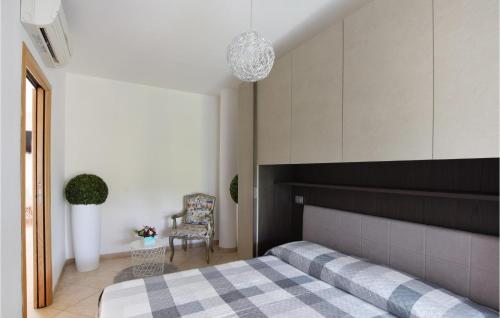 En eller flere senge i et værelse på Casa Vacanze Villabel