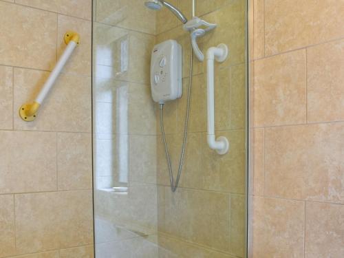 a shower in a bathroom with aitizer in a shower stall at Melrose in Clitheroe
