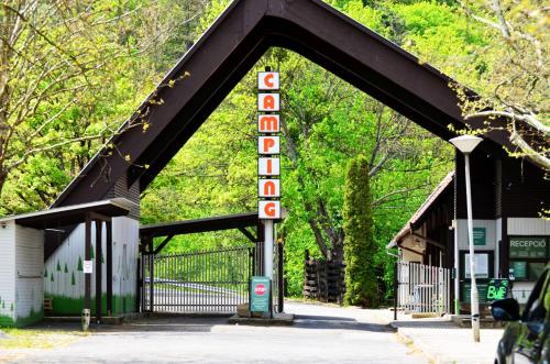 a building with a sign that says polocooco at Chilling On Orfű Apartman in Orfű