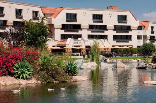 a hotel with ducks in the water in front of a building at Courtyard by Marriott San Diego Rancho Bernardo in Rancho Bernardo