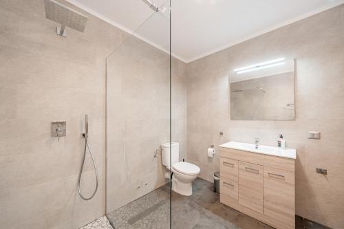 a bathroom with a shower and a toilet and a sink at C'an Crespí in Consell