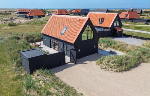 an overhead view of a house with an orange roof at Lovely Home In Skagen With Wifi in Skagen