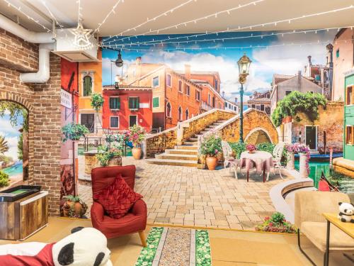 a mural of a city street with animals wallpaper at Omotenashi Hostel Miyajima in Hatsukaichi