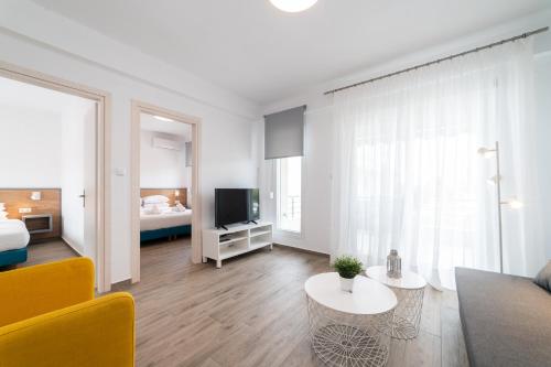Postel nebo postele na pokoji v ubytování Danai & Palm Residential Complexes