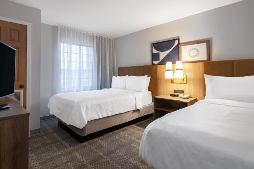 Ένα ή περισσότερα κρεβάτια σε δωμάτιο στο Staybridge Suites Columbus-Dublin by IHG