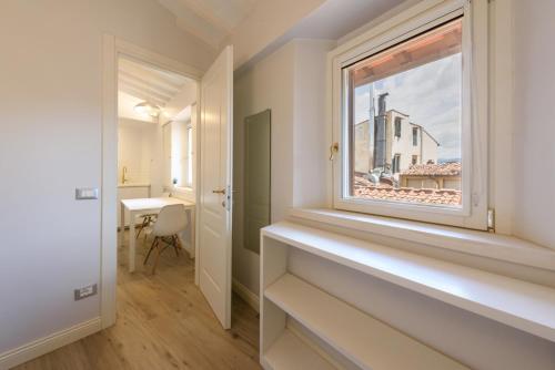 a window in a room with a view of a building at Santa Croce Top by Mmega in Florence