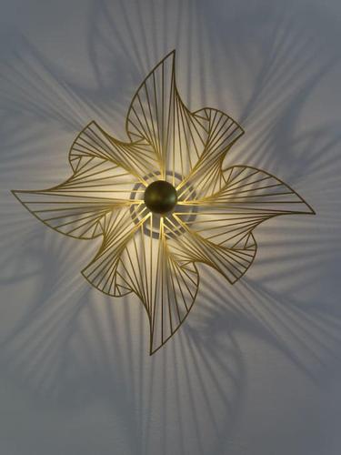 a gold flower is on top of a ceiling at Ferienhof Greuthof in Bad Wurzach