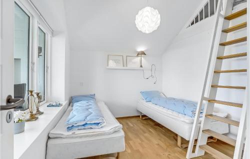 a room with a bunk bed and a ladder at 4 Bedroom Nice Home In Slagelse in Slagelse
