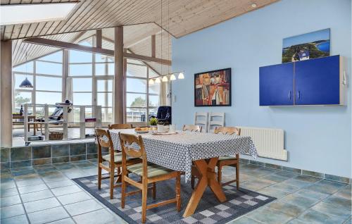 a dining room with a table and chairs at Holiday Home Juliusvej Gørlev Ix in Reersø