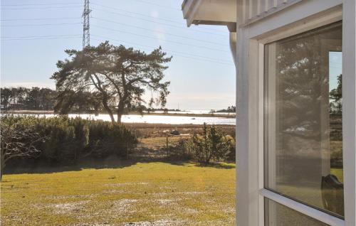 a window of a house with a view of a field at Amazing Home In Rockneby With Wifi in Rockneby