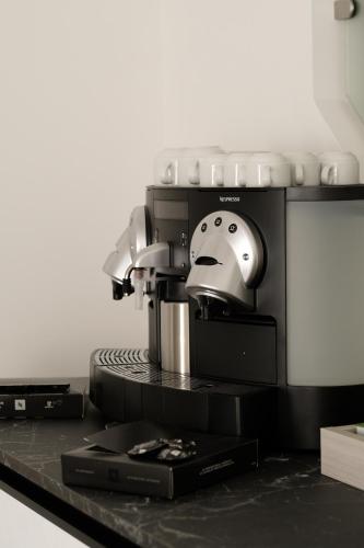 a coffee maker sitting on top of a counter at Domea Superior Rooms Bed and Breakfast in Reggio Calabria