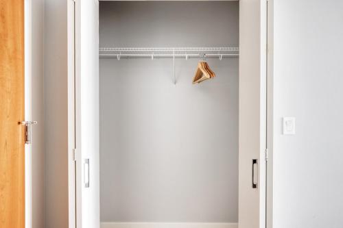 a closet with a white door and a shelf at Arlington Heights 2br w wd gym bbq nr dining CHI-911 in Arlington Heights
